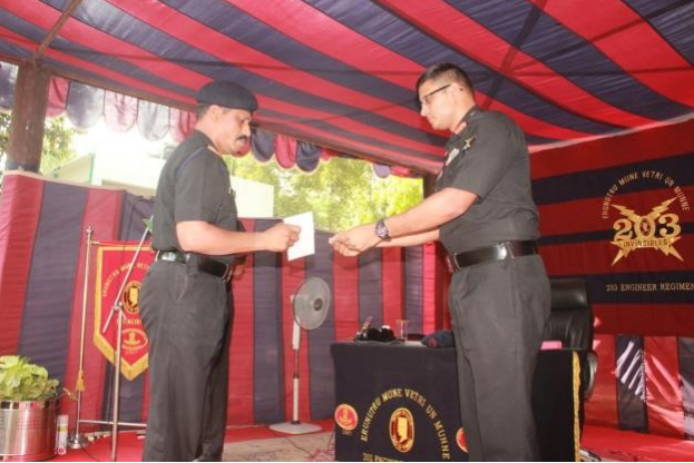 Soldiers of 203 Engineering Regiment in the Eastern Sector receiving Scholarship on behalf of their children from the Commanding Officer